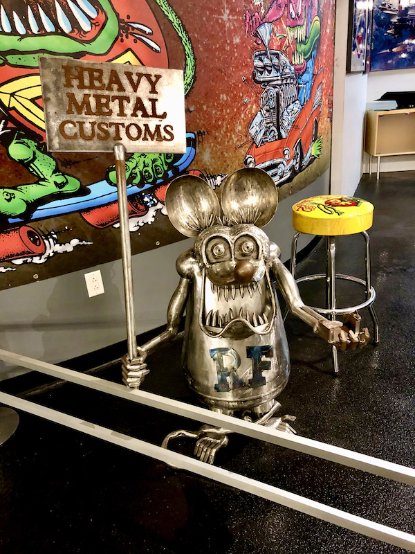 A metal sculpture of a cartoon rat at the National Corvette Museum
