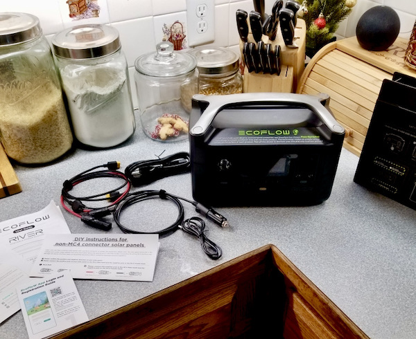 A black power pack with cords sitting on a kitchen counter from Fabulous Gifts for Campers