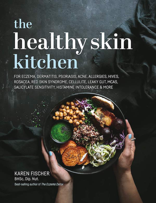 A black book cover with a plate of food and white lettering that says the Healthy Skin Kitchen