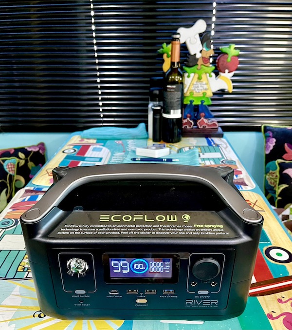 A rectangular black power pac on a turquoise table from Fabulous Gifts for Campers
