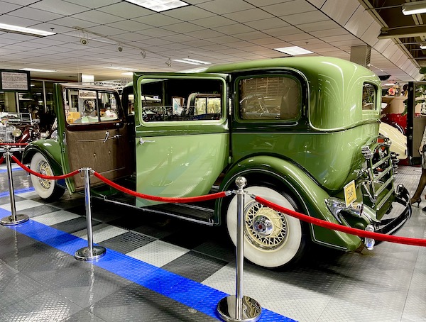 A lime green antique car.