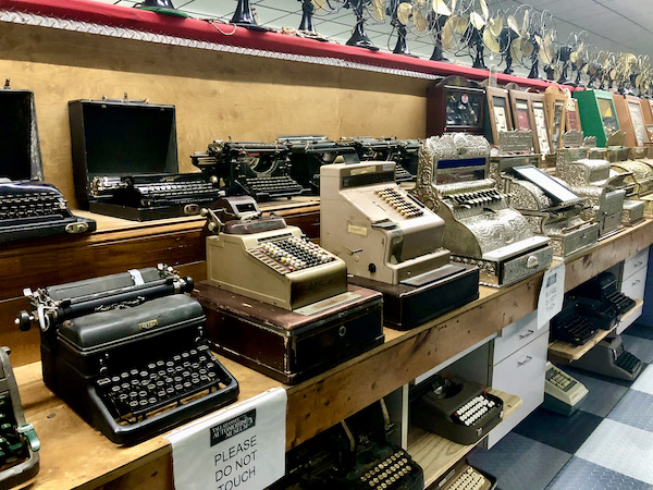 Old adding machines and typewriters on display