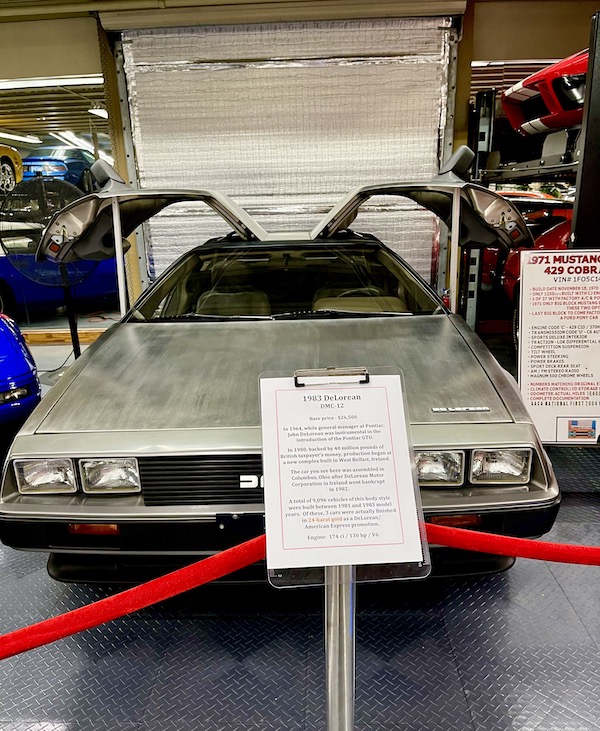 A brushed metal car with gull wing doors at the Tallahassee Automobile Museum