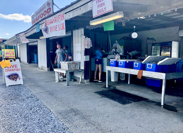Storefronts of seafood vendors at the Westwego Shrimp Lot Louisiana