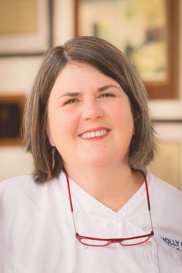 A woman with medium brown hair who is the author of Just a Few Miles South