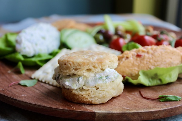 A platter of lettuce, cucumber slices, grapes and benedictine on a biscuit from Just a Few Miles South