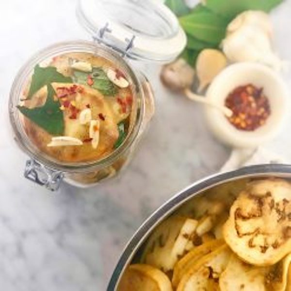 Plates of pickled eggplant and other condiments from Sobremesa - A Memoir of Food and Love
