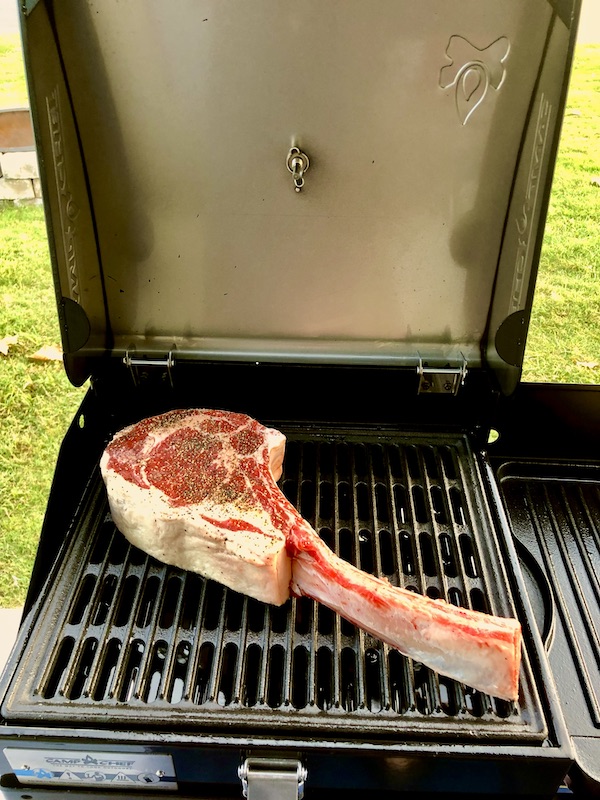 A bone in Tomahawk Steak on the Grill
