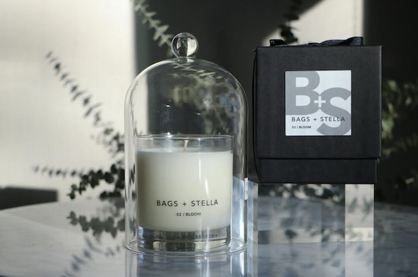 A large white pillar candle under a glass dome from 15 Best Gifts for Foodies and RVers