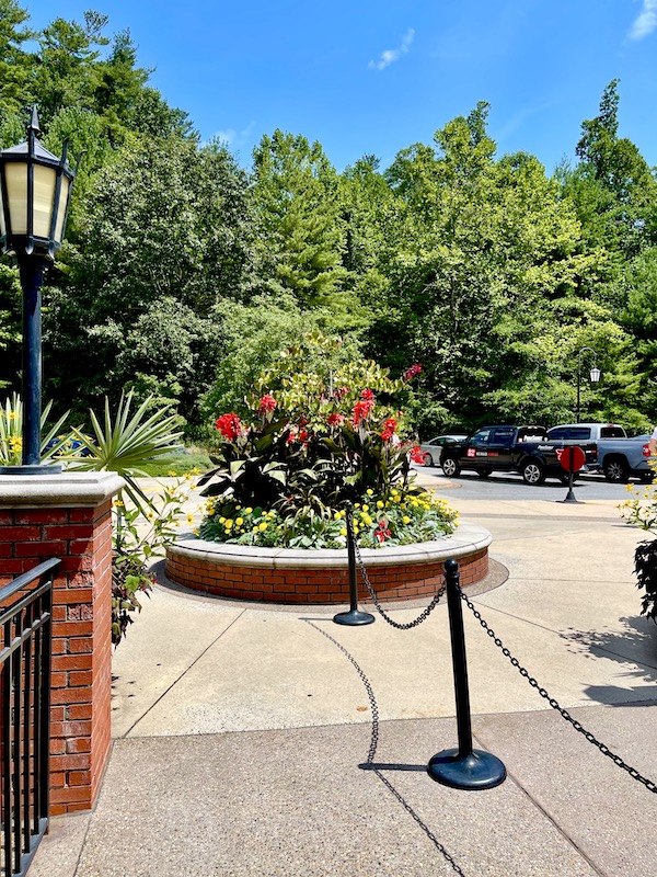 A patio with garden flowers in a circular bed at Art Mecca Asheville North Carolina
