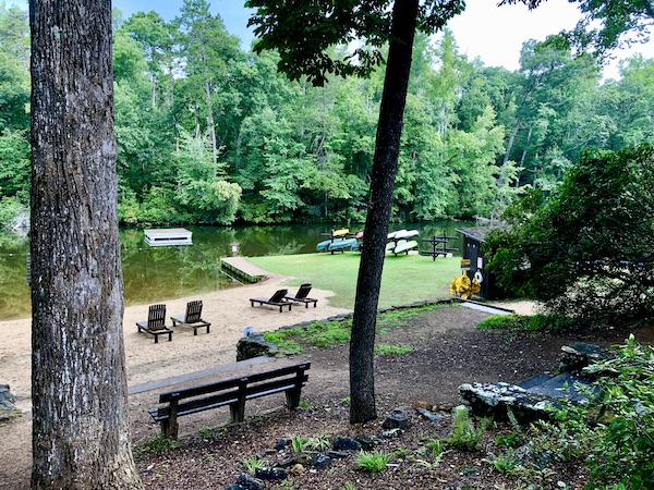 A park with a lake and benches, plenty of trees for shade near Beautiful Greenville South Carolina