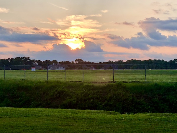Sunset sky, grassy air strip before dinner at Hamburger Joe's North Myrtle Beach SC