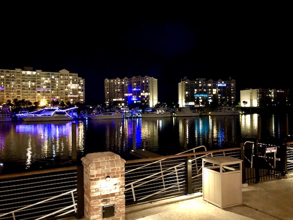 Deck seating at Taco Mundo North Myrtle Beach overlooks the river, large yacht and condos