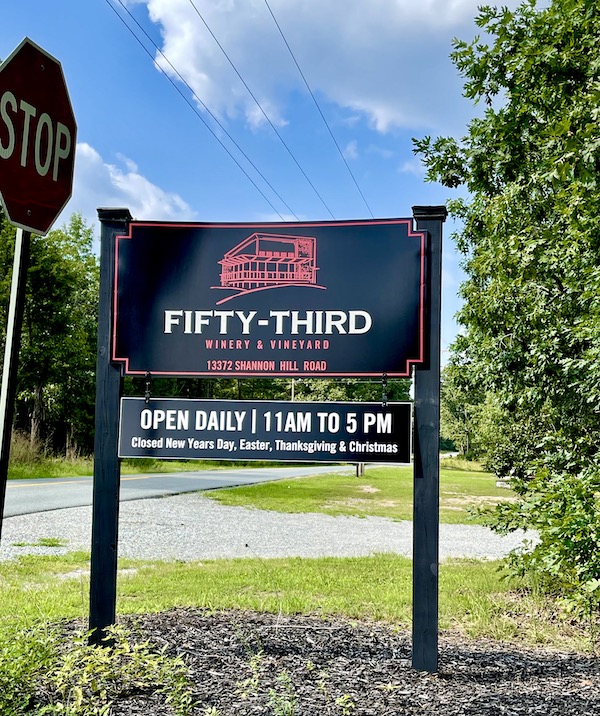 A black and red sign for 53rd winery in Louisa VA Small Town Big Impact
