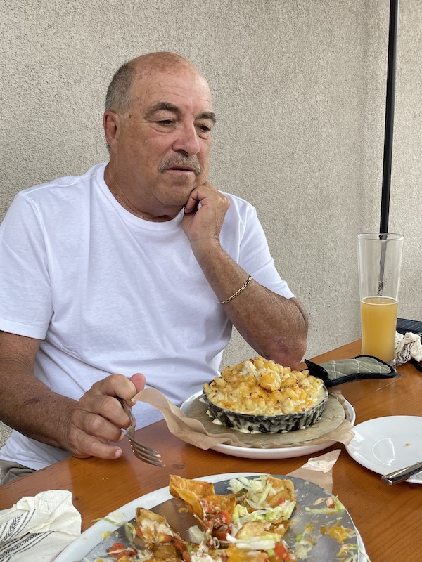 A man with a huge portion of mac and cheese wondering how he can eat it all at Mudhen Brewing Wildwood NJ