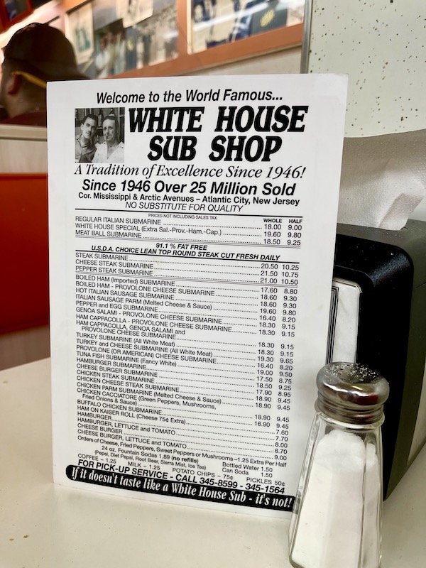 A black and white menu on a formica tabletop on Our Pilgrimage to the Jersey Shore