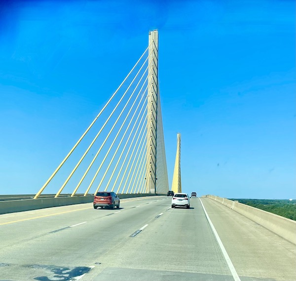 A suspension bridge over water on Our Pilgrimage to the Jersey Shore