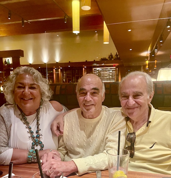 A silver haired woman sitting with two men at Seasons 52 Cherry Hill NJ
