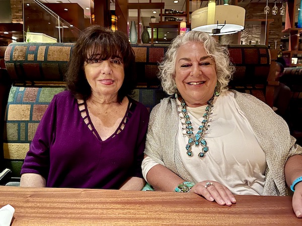 A dark haired woman and a silver haired woman sitting in a booth at Seasons 52 Cherry Hill NJ