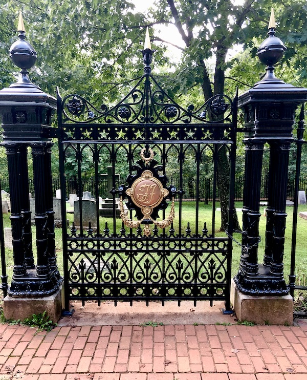 Black trough iron gate with gold medallion at Thomas Jefferson's Monticello