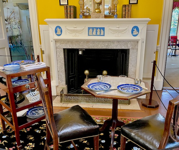 An intimate dining room with table for two and fireplace at Thomas Jefferson's Monticello