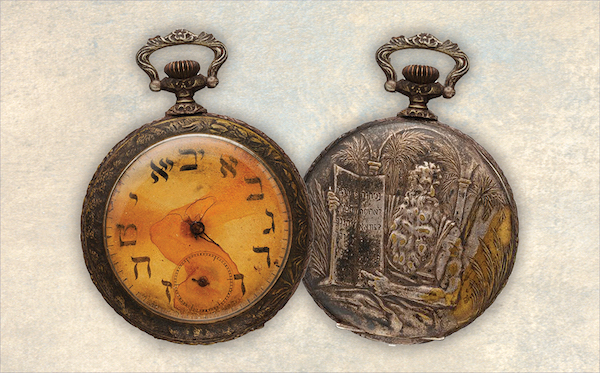 Front and back of an antique Hebrew pocket watch from Aboard Titanic Pigeon Forge TN