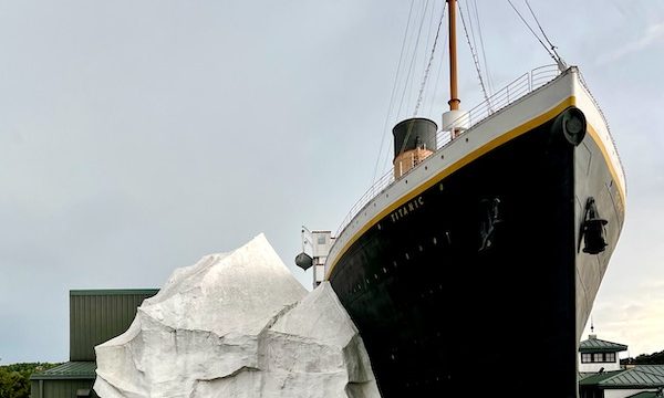 A replica of Titanic and the iceberg seen streetside.