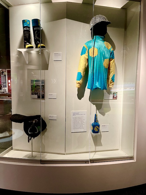 A turquoise and yellow outfit worn on Dancing with the Stars by a jockey.