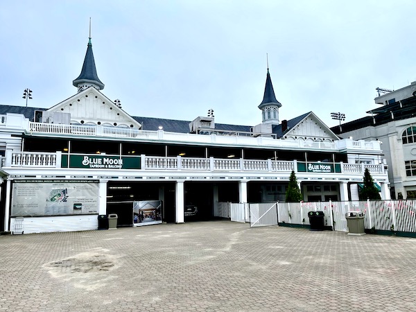 A white building with spires and sand in front at Churchill Downs Louisville Kentucky