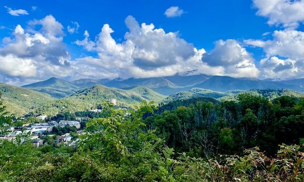 A range of mountains, trees and buildings way below at Great Smoky Mountains National Park