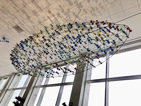 A wire sculpture with colored glass orbs, hanging from the ceiling at the Knoxville Museum of Art Tennessee