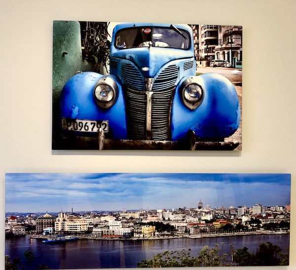 A photo of a 1938 blue Ford V8 above a photo of Havana harbor at the Knoxville Museum of Art Tennessee