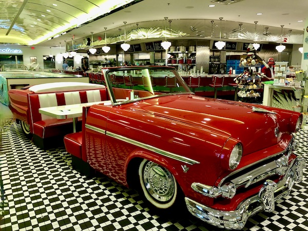 A vintage red Ford convertible turned into a dining booth at the Sunliner Diner Pigeon Forge TN
