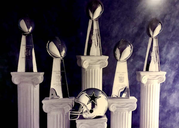 A display of 5 trophies seen on our Dallas Cowboys Stadium Tour