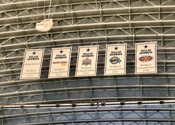 Five banners with the year of each of the 5 Dallas Cowboys Super Bowl Wins seen on our Dallas Cowboys Stadium Tour