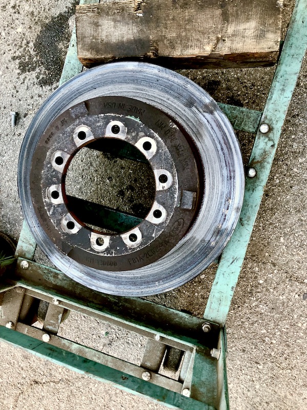 RV brake from one wheel sitting on a dolly before we got new brakes for Ladybug!