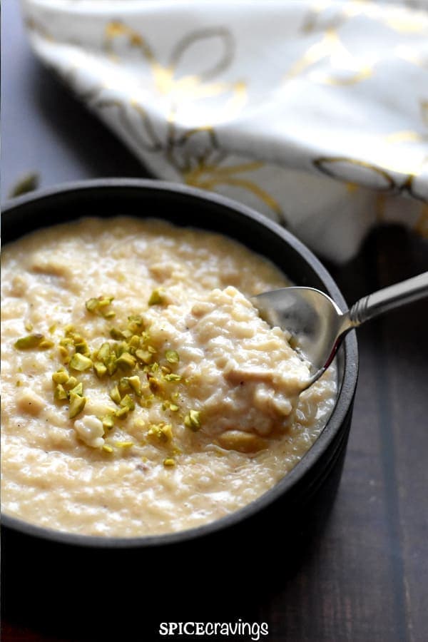 A dark gray pot filled with rice pudding and a tablespoon from Top Hacks for Successfully Observing a Healthy Diet