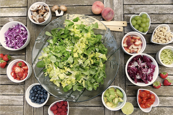 Bowls of assorted sizes filled with a variety of salad ingredients
