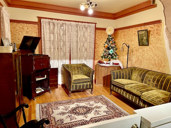 Vintage living room with olive club chair and sofa.