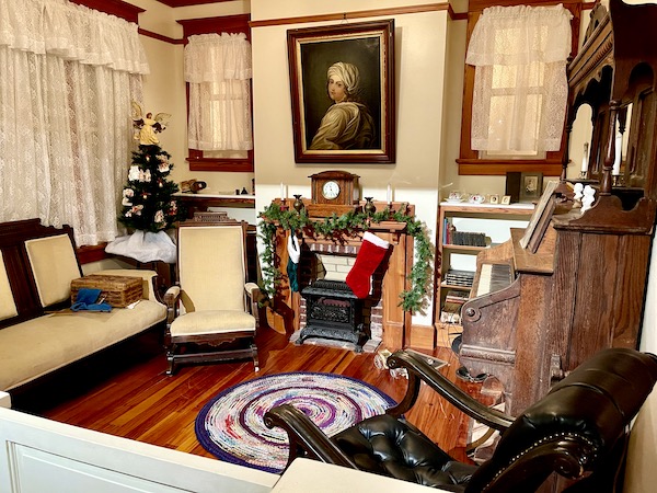 An old fashioned living room with fireplace seen during Abilene Art Walk and Pizza