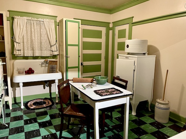 A white and green kitchen from the roaring 20s seen during Abilene Art Walk and Pizza