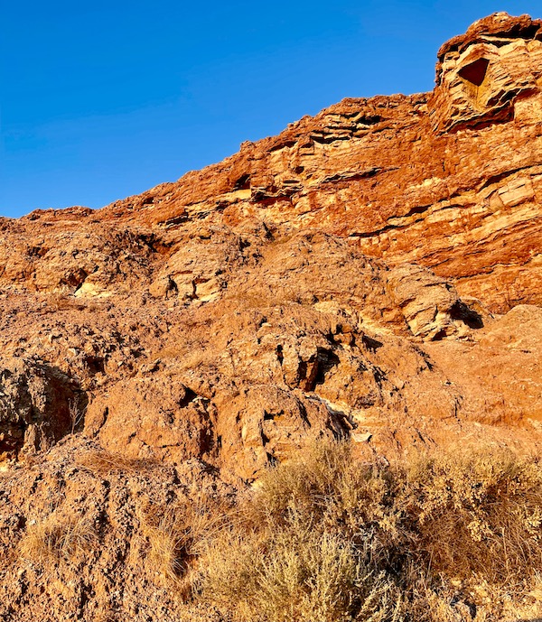 A rocky mountain with small cave openings at Bottomless Lakes State Park Roswell NM