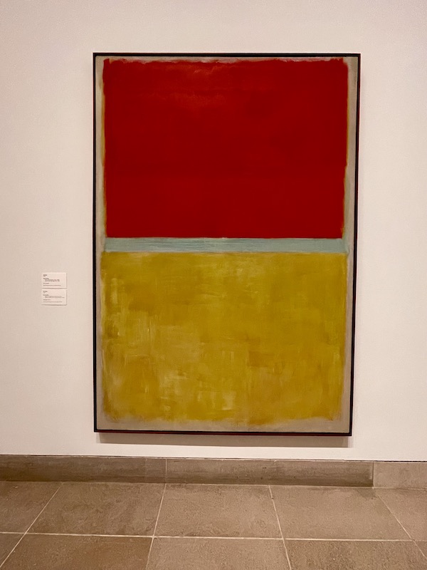 A painting that is simply half red and half mustard yellow at the Dallas Museum of Art.