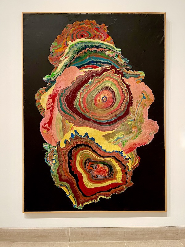 Swirls of colors on a black background at the Dallas Museum of Art