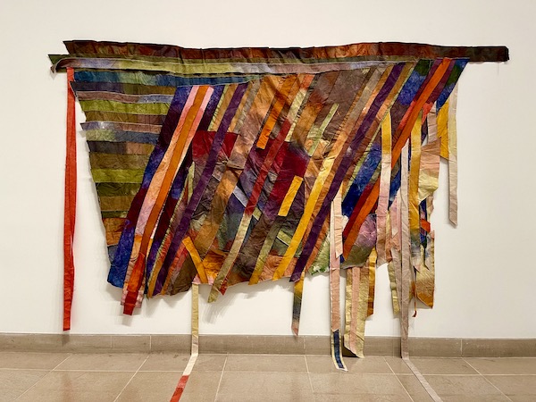 Colorful strips of painted canvas and other fabrics create this art at the Dallas Museum of Art.