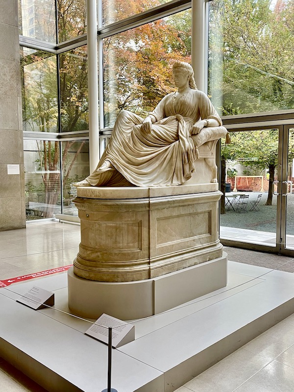 A marble sculpture of a woman in draped gown at the Dallas Museum of Art