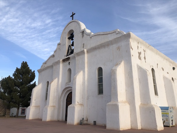 A white adobe church seen along the El Paso Texas Mission Trail