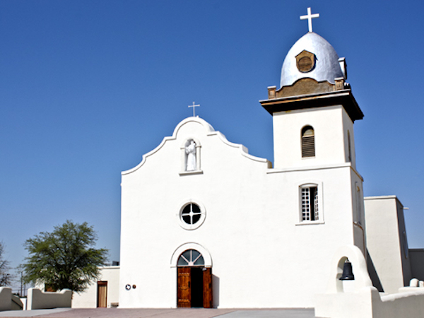A white, dome roofed, Spanish style church along the El Paso Texas Mission Trail