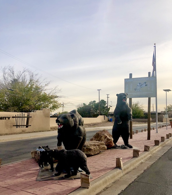 Statues of black bears of all sizes on a street median along the El Paso Texas Mission Trail