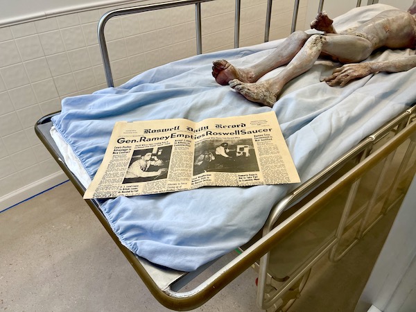 A yellowed newspaper from 1947 lies at the feet of an alien at the International UFO Museum Roswell NM
